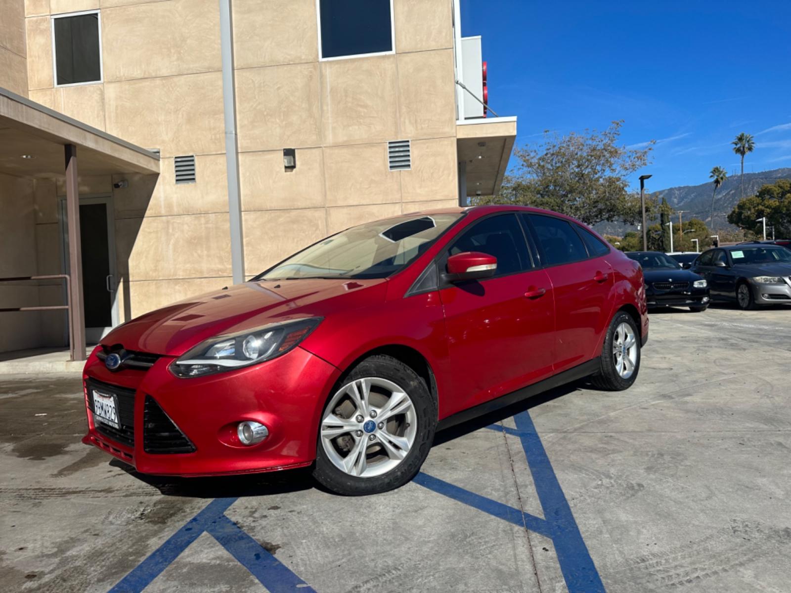 2012 RED /BLACK Ford Focus SE Sedan (1FAHP3F29CL) with an 2.0L L4 DOHC 16V engine, AUTOMATIC transmission, located at 30 S. Berkeley Avenue, Pasadena, CA, 91107, (626) 248-7567, 34.145447, -118.109398 - New Tires! Nice Interior! drives and looks good! Bad credit? We can help! We are the bank. All our cars are thoroughly inspected and reconditioned by our technicians. FREE CARFAX report. Stop by or call to speak with our friendly staff. Whether you have bad credit, no credit, bankruptcy, or reposse - Photo #0